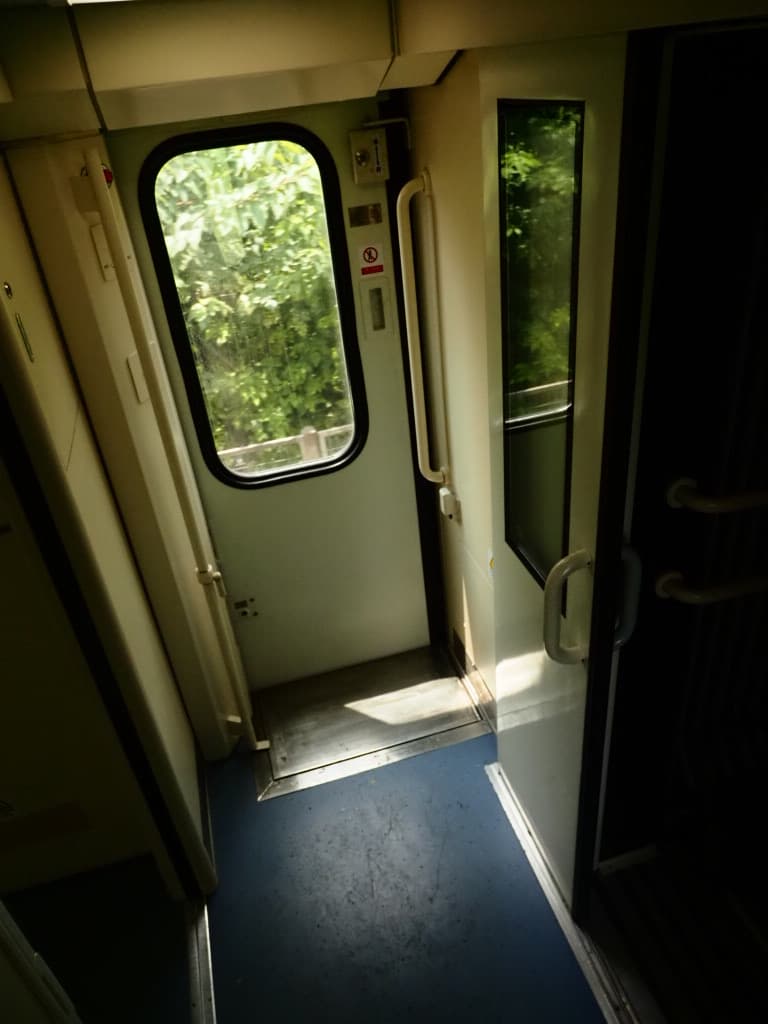 Sunlight hitting the quiet area between train carriages
